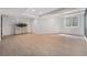 Unfinished basement with light wood flooring, recessed lighting, and a small window at 13275 Holly St # B, Thornton, CO 80241