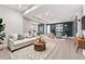 Finished basement with light wood flooring, modern sofa, and stylish decor at 13275 Holly St # B, Thornton, CO 80241