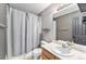 The full bathroom offers a shower and tub combo and plenty of storage under the sink at 13275 Holly St # B, Thornton, CO 80241