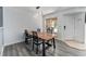 Dining area featuring a modern light fixture and a wooden table with black chairs at 13275 Holly St # B, Thornton, CO 80241
