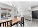 Bright dining area with modern lighting and a view of the living space at 13275 Holly St # B, Thornton, CO 80241