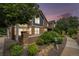 Beautiful townhome with stone accents and lush landscaping, showcasing curb appeal in a well-maintained community at 13275 Holly St # B, Thornton, CO 80241