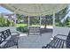 Picturesque gazebo with bench seating, surrounded by lush greenery, offering a relaxing spot in the community at 13275 Holly St # B, Thornton, CO 80241