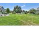 Well-maintained community green space with benches, playground, and a gazebo at 13275 Holly St # B, Thornton, CO 80241