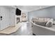 Bright living room with fireplace, large window, and comfortable sectional at 13275 Holly St # B, Thornton, CO 80241