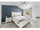 The main bedroom features vaulted ceilings, soft carpet, and a large bright window at 13275 Holly St # B, Thornton, CO 80241