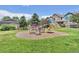 Fun playground area with slides, steps, and a soft landing surface, located near townhomes at 13275 Holly St # B, Thornton, CO 80241