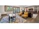 Finished basement with a play area, sitting area, and outdoor views at 6016 Stone Creek Dr, Evergreen, CO 80439