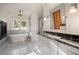 Elegant bathroom with a freestanding tub, marble countertops, and sleek fixtures at 6016 Stone Creek Dr, Evergreen, CO 80439