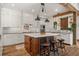 Well-equipped kitchen featuring a marble-topped island, modern appliances, and farmhouse-style accents at 6016 Stone Creek Dr, Evergreen, CO 80439