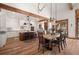 Open kitchen with stainless steel appliances, center island, and hardwood floors at 6016 Stone Creek Dr, Evergreen, CO 80439