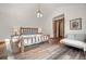 Bright main bedroom featuring wood accents, vaulted ceilings, and a comfortable seating area at 6016 Stone Creek Dr, Evergreen, CO 80439