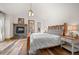 Serene main bedroom with vaulted ceilings, a stone fireplace, and natural wood accents at 6016 Stone Creek Dr, Evergreen, CO 80439