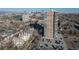 High-rise building aerial view, showcasing city skyline and parking at 130 N Pearl St # 604, Denver, CO 80203