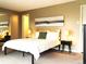 Primary bedroom with neutral carpet, paint and stylish decor at 2225 Buchtel Blvd # 202, Denver, CO 80210