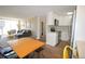 Bright living room with modern decor, hardwood floors, and an open concept kitchen and dining area at 2225 Buchtel Blvd # 202, Denver, CO 80210