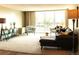 Comfortable living room filled with natural light, modern furniture, and a sliding glass door to a balcony at 2225 Buchtel Blvd # 202, Denver, CO 80210
