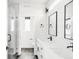 Modern bathroom boasts dual vanities, a glass-enclosed shower, and stylish fixtures at 3955 W 13Th Ave, Denver, CO 80204