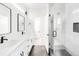 Beautiful bathroom features a double sink vanity and glass shower with modern finishes at 3955 W 13Th Ave, Denver, CO 80204