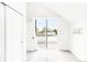 Bright bedroom with access to balcony, a large window, and spacious closet at 3955 W 13Th Ave, Denver, CO 80204