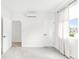 A bright airy bedroom featuring a neutral pallette and modern features like a built in a/c unit at 3955 W 13Th Ave, Denver, CO 80204