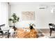 A cozy living room with a textured rug, wood accent table, and stylish decorative plants at 3955 W 13Th Ave, Denver, CO 80204