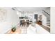 Open living space with modern kitchen, dining area, and staircase, ideal for entertaining at 3955 W 13Th Ave, Denver, CO 80204