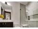Sleek bathroom with a glass enclosed shower and modern vanity with marble counters at 2300 Boreas Pass Rd, Breckenridge, CO 80424