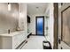 Stylish bathroom featuring a white vanity, decorative wall tile, and a glass-enclosed shower at 2300 Boreas Pass Rd, Breckenridge, CO 80424