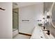 Modern bathroom with double sink vanity, stylish mirrors, and glass-enclosed shower at 2300 Boreas Pass Rd, Breckenridge, CO 80424
