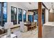 Elegant dining room with ample natural light, modern lighting fixtures, and mountain views for perfect Gathering dinners at 2300 Boreas Pass Rd, Breckenridge, CO 80424