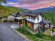 Charming exterior with beautiful stonework, multiple levels, and outdoor seating areas overlooking the mountains at 2300 Boreas Pass Rd, Breckenridge, CO 80424