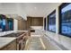 Bright kitchen featuring a large island, custom cabinetry, and mountain views, creating an inviting cooking space at 2300 Boreas Pass Rd, Breckenridge, CO 80424