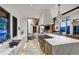 Modern kitchen with marble countertops, a large island, and stainless steel appliances, perfect for culinary enthusiasts at 2300 Boreas Pass Rd, Breckenridge, CO 80424