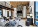 Inviting living room with modern fireplace, wood accents, and comfortable seating, ideal for relaxing and entertaining at 2300 Boreas Pass Rd, Breckenridge, CO 80424
