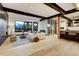 Open living room with hardwood floors, mountain views, and a sleek modern design at 2300 Boreas Pass Rd, Breckenridge, CO 80424