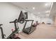 Basement with a treadmill, and peloton and an entertainment and play area at 536 S Vine St, Denver, CO 80209