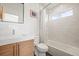 Modern bathroom with sleek vanity, tiled walls, and a shower-tub combination at 536 S Vine St, Denver, CO 80209