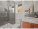 Modern bathroom featuring a glass shower, floating vanity, and sleek gray tile at 536 S Vine St, Denver, CO 80209