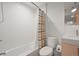 Clean bathroom with a shower and bath combo, a modern sink, and vanity at 536 S Vine St, Denver, CO 80209