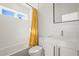 Bathroom features a shower-tub, window, modern vanity, and new toilet at 536 S Vine St, Denver, CO 80209