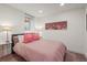 Basement bedroom with a comfy bed and skyline wall art at 536 S Vine St, Denver, CO 80209