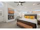 Bedroom featuring a fireplace, modern decor, and large windows providing ample sunlight at 536 S Vine St, Denver, CO 80209
