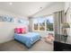 Bright bedroom features a large window with neighborhood views and a cozy atmosphere at 536 S Vine St, Denver, CO 80209
