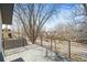 Balcony deck overlooks a residential street with mature trees and neighborhood views at 536 S Vine St, Denver, CO 80209
