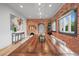 Elegant dining room with exposed brick, a wooden table, and stylish lighting fixtures at 536 S Vine St, Denver, CO 80209