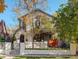 Attractive home boasting a well-maintained front yard and a stylish exterior with black railing at 536 S Vine St, Denver, CO 80209