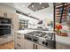 Modern kitchen featuring stainless steel appliances, and open layout that flows to the living room at 536 S Vine St, Denver, CO 80209