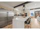 Modern kitchen featuring a large center island, stainless steel appliances, and seamless open-concept design at 536 S Vine St, Denver, CO 80209
