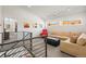 Upstairs living room with modern railings, comfortable seating, and plenty of natural light at 536 S Vine St, Denver, CO 80209
